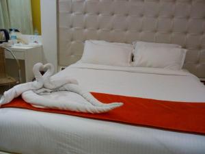 Postel nebo postele na pokoji v ubytování Setrac Orange Hotel