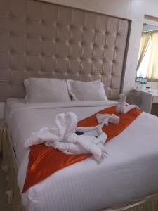 Postel nebo postele na pokoji v ubytování Setrac Orange Hotel