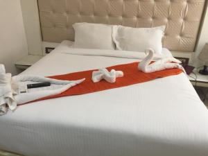 Postel nebo postele na pokoji v ubytování Setrac Orange Hotel + 36 fotografií