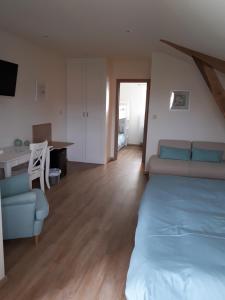 Postel nebo postele na pokoji v ubytování B&B De Fruithoeve