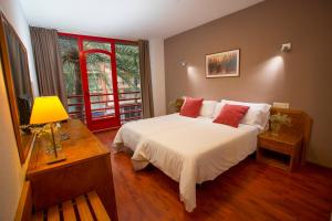 Postel nebo postele na pokoji v ubytování Hotel Borgia + 28 fotografií