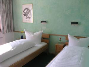 Postel nebo postele na pokoji v ubytování Humboldt-Haus