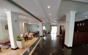 a lobby with white columns and a living room at Aparthouse Borovo near Bulgaria Mall, free street parking in Sofia