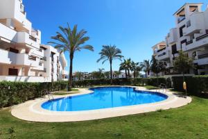 an image of a swimming pool in front of apartment buildings at Altos de Nuevo Vera in Vera