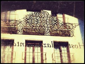 a building with a design on the side of it at Hostal Boutique Plaza Cantarero in Nerja