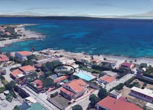 an aerial view of a town next to the ocean at Villa Aurora in Ognina