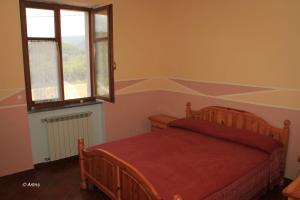 Postel nebo postele na pokoji v ubytování Agriturismo La Praduscella