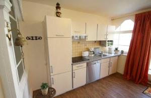 Köök või kööginurk majutusasutuses Strandvilla Rheingold - Ferienwohnung Miro
