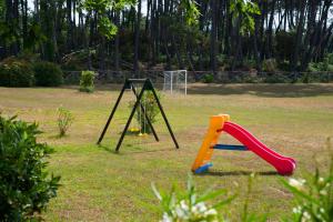 a playground with a swing set in a park at Residence Tourist in Lucca