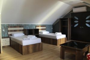 Postel nebo postele na pokoji v ubytování Hotel Lion