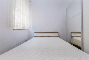 Ένα ή περισσότερα κρεβάτια σε δωμάτιο στο Apartment Arena