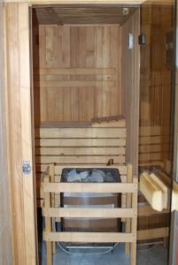 a room with a sauna with a bed in it at Farm Stay Bogša in Ormoz