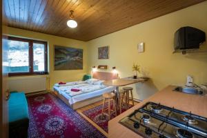A bed or beds in a room at Chalupa LUKA Terchová