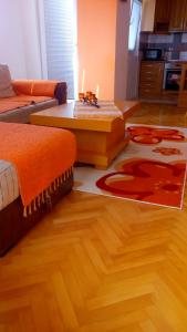 a living room with a couch and a coffee table at S.K Apartments in Ohrid