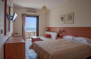 Katil atau katil-katil dalam bilik di Corali Hotel