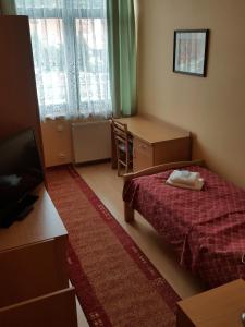 Łóżko lub łóżka w pokoju w obiekcie Grand Hotel