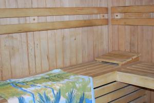 a sauna with a bed and a bench in it at Farm Stay Bogša in Ormoz