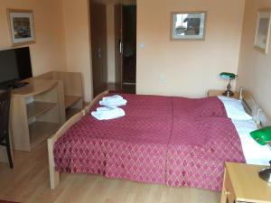 Łóżko lub łóżka w pokoju w obiekcie Grand Hotel