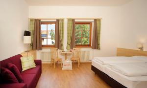 Postel nebo postele na pokoji v ubytování Hotel Masatsch