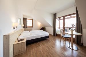 Postel nebo postele na pokoji v ubytování Hotel Masatsch