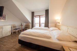 Postel nebo postele na pokoji v ubytování Hotel Masatsch