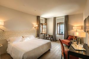 Letto o letti in una camera di Hotel Laurin