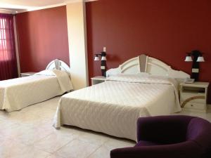 Rúm í herbergi á Hotel Castilla