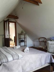 a bedroom with a white bed with two pillows on it at apartman-bartko in Banská Štiavnica
