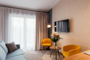 Televízia a/alebo spoločenská miestnosť v ubytovaní Avena Boutique Hotel by Artery Hotels
