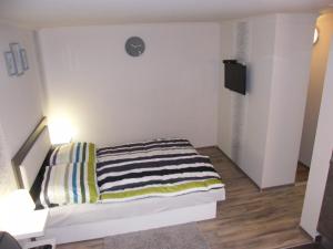 Posteľ alebo postele v izbe v ubytovaní Gyarmati Apartman