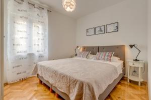 Posteľ alebo postele v izbe v ubytovaní Apartment Sun & Sea
