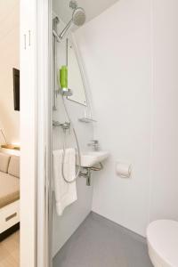 a bathroom with a sink and a mirror at Glamping Resort Biosphäre Bliesgau in Kleinblittersdorf