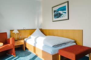 Postel nebo postele na pokoji v ubytování Aparthotel Kachelot