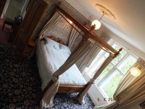 Postel nebo postele na pokoji v ubytování Greystones B&B
