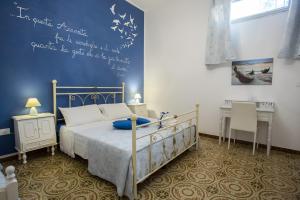 En eller flere senge i et værelse på Casa Poesia