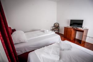 Ένα ή περισσότερα κρεβάτια σε δωμάτιο στο Hotel BOB