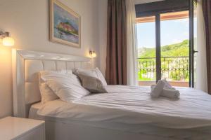 Tempat tidur dalam kamar di Rosmarino
