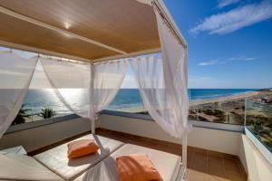 a balcony with a view of the ocean at SBH Crystal Beach Hotel & Suites - Adults Only in Costa Calma