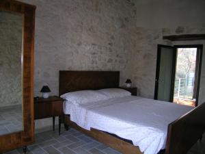 Postel nebo postele na pokoji v ubytování Masseria del Ponte