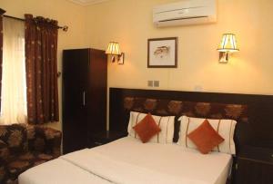 Ένα ή περισσότερα κρεβάτια σε δωμάτιο στο Chantella Suites