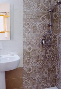 a bathroom with a shower and a sink at Agriturismo San Leonardo in Centola