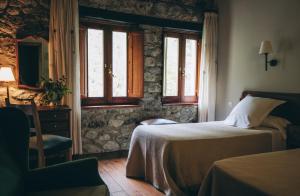 Postel nebo postele na pokoji v ubytování Hotel Caldas