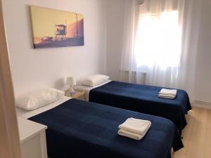 Postel nebo postele na pokoji v ubytování Caputxins Apartment