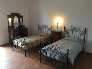 מיטה או מיטות בחדר ב-Herdade Do Charito