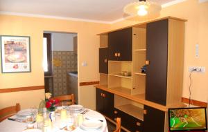 a kitchen with a table and a dining room at Case Gran Paradiso Rhemes Notre Dame in Rhêmes-Notre-Dame