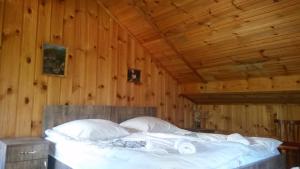 Ένα ή περισσότερα κρεβάτια σε δωμάτιο στο Lagami house