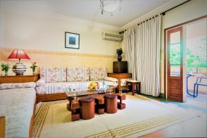 a living room with a couch and a table at Hotel Oudaya & Spa in Marrakesh