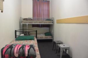 Postel nebo postele na pokoji v ubytování Elizabeth Hostel