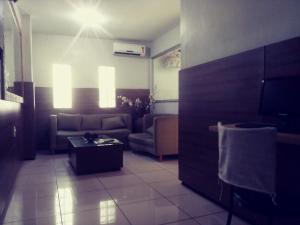 a living room with a couch and a table at Seamar Hotel in Fortaleza