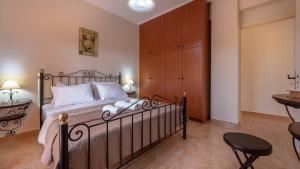 Posteľ alebo postele v izbe v ubytovaní Pothos Villas